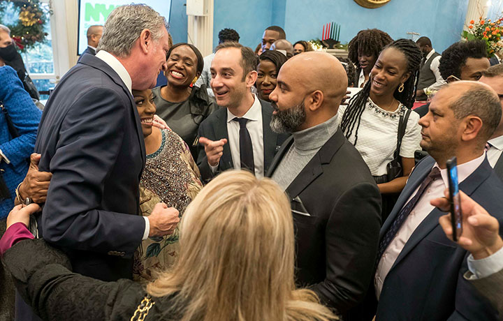 Mayor Bill de Blasio interacting with guests at the reception.