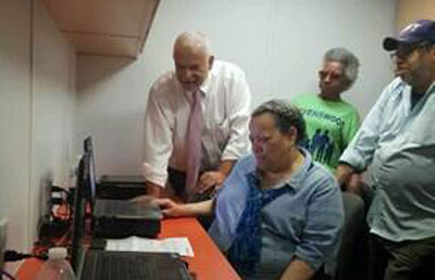 NYCHA General Manager (Left) and Tenant Association President Carol Wilkins (Second Left) receive a demonstration of the Digital Van’s services