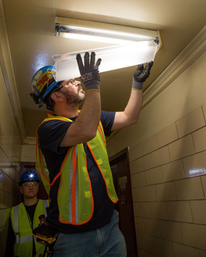 Worker Installs New Lighting