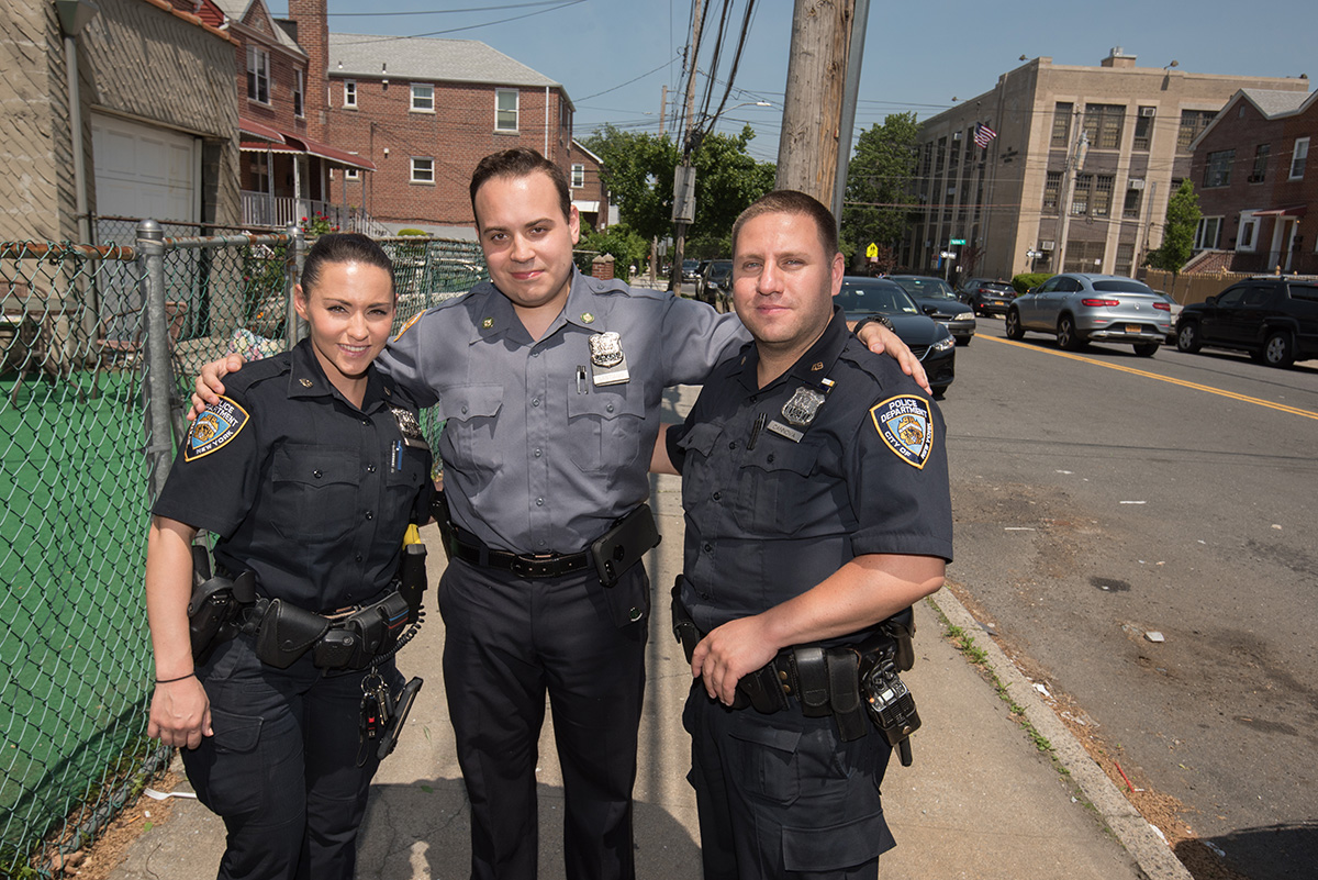 Cannova and Varela posing on the street with NYPD recruit Eric Santiago