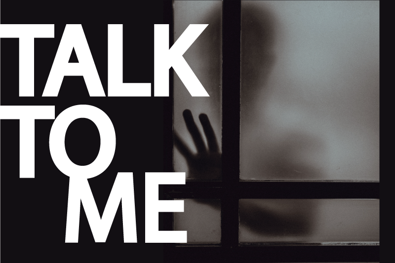 The words “Talk to Me” over a blurry silhouette of a person with their hand against a window