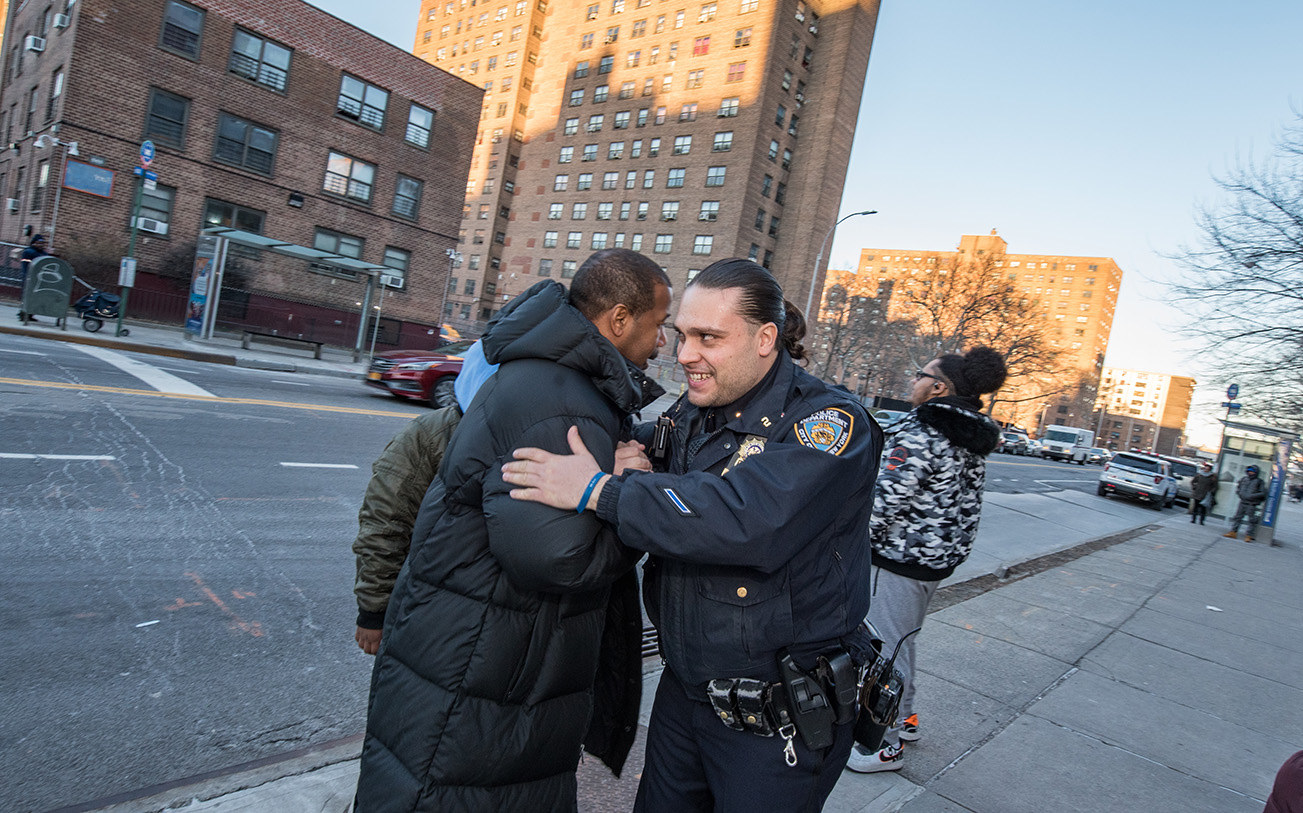 Police officer hugs a resident