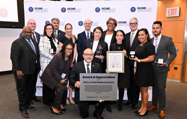 OCME officials and partners gather around recognition award presented by LiveOnNY at special ceremony in honor of support for organ donation
                                           