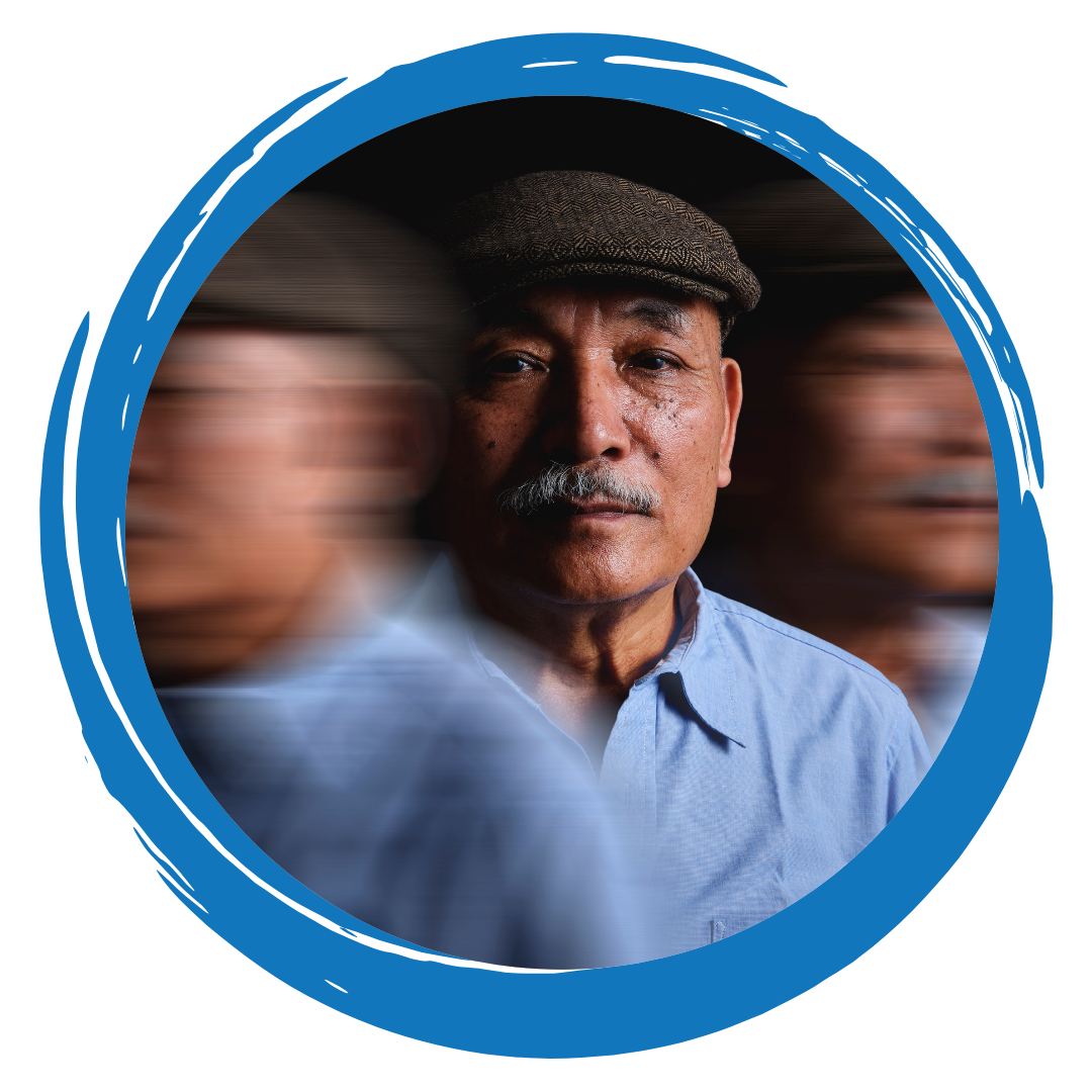 Person wearing a blue shirt and grey cap