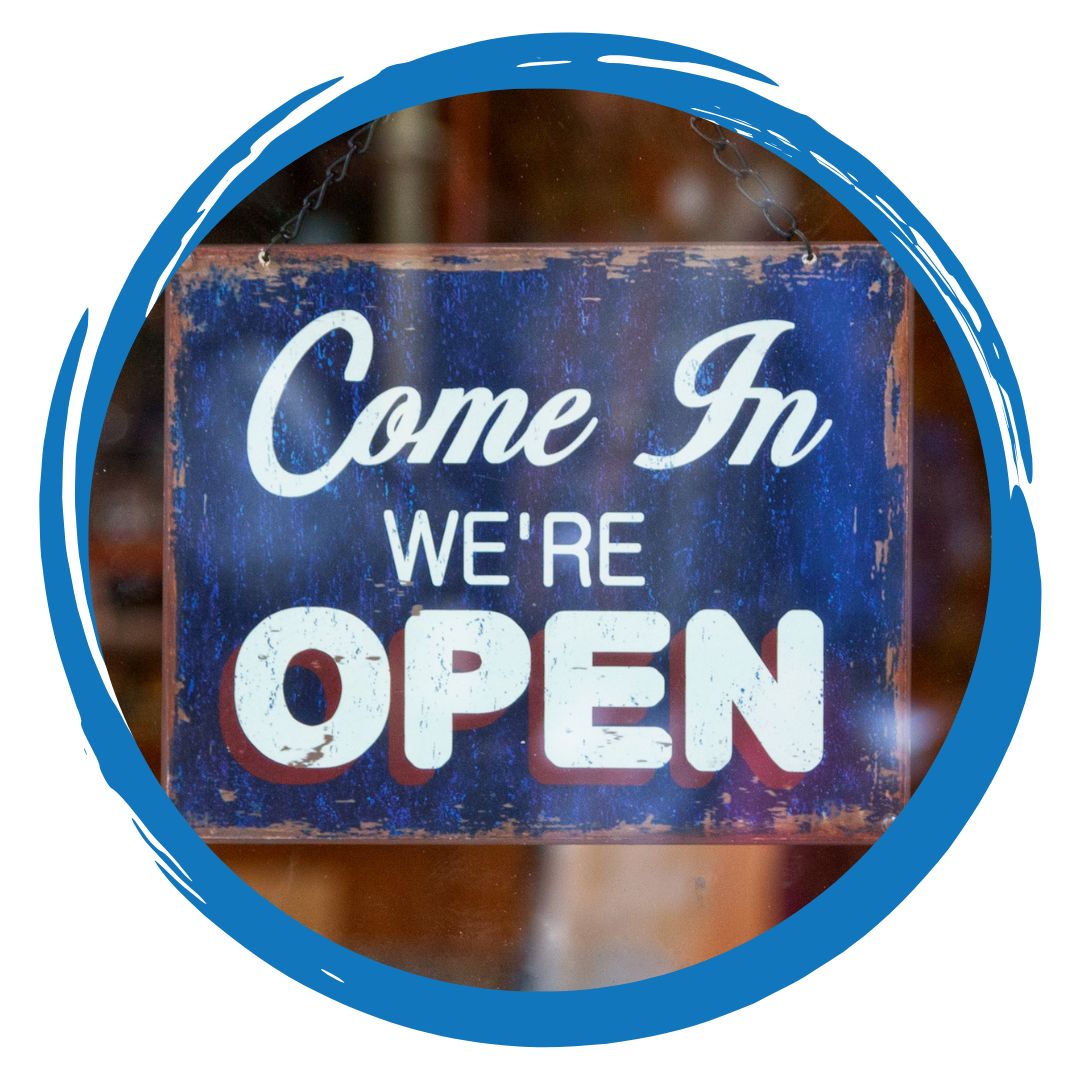Hanging sign with words that say Come in we're open
