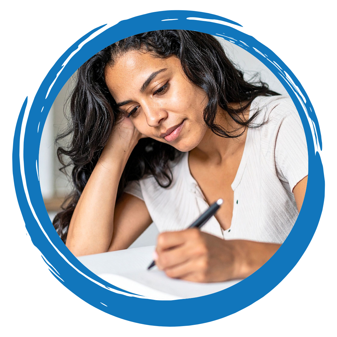 A person writing in a journal