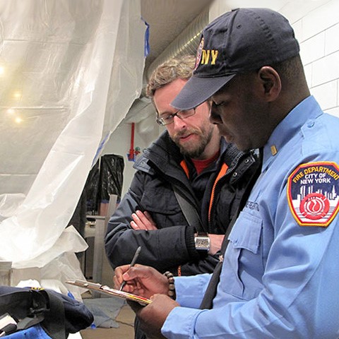 Two people looking at clipboard