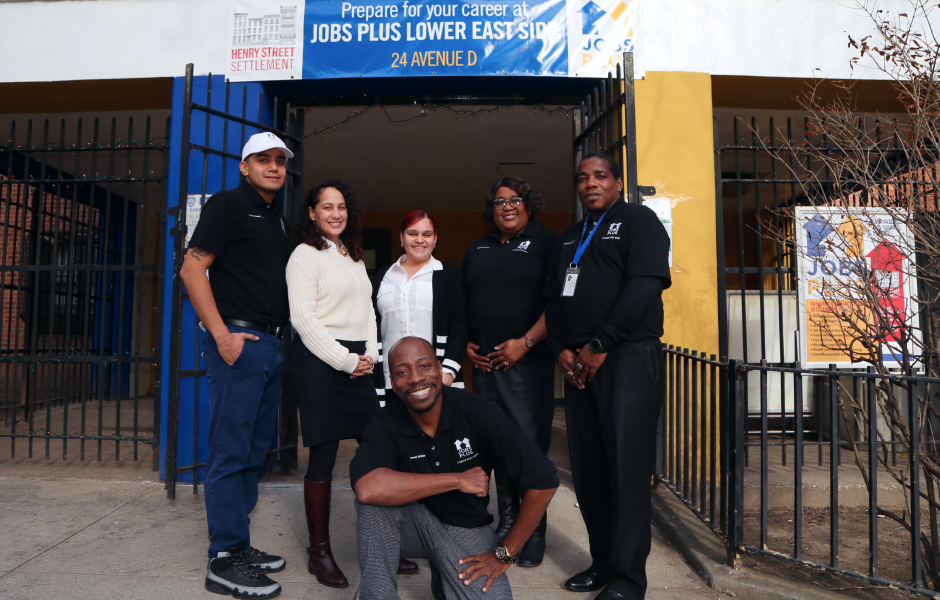 Group of people standing in front of a new Jobs-Plus site in the Lower East Side