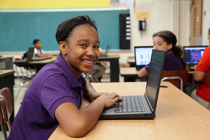 Young Students in a classroom with computers