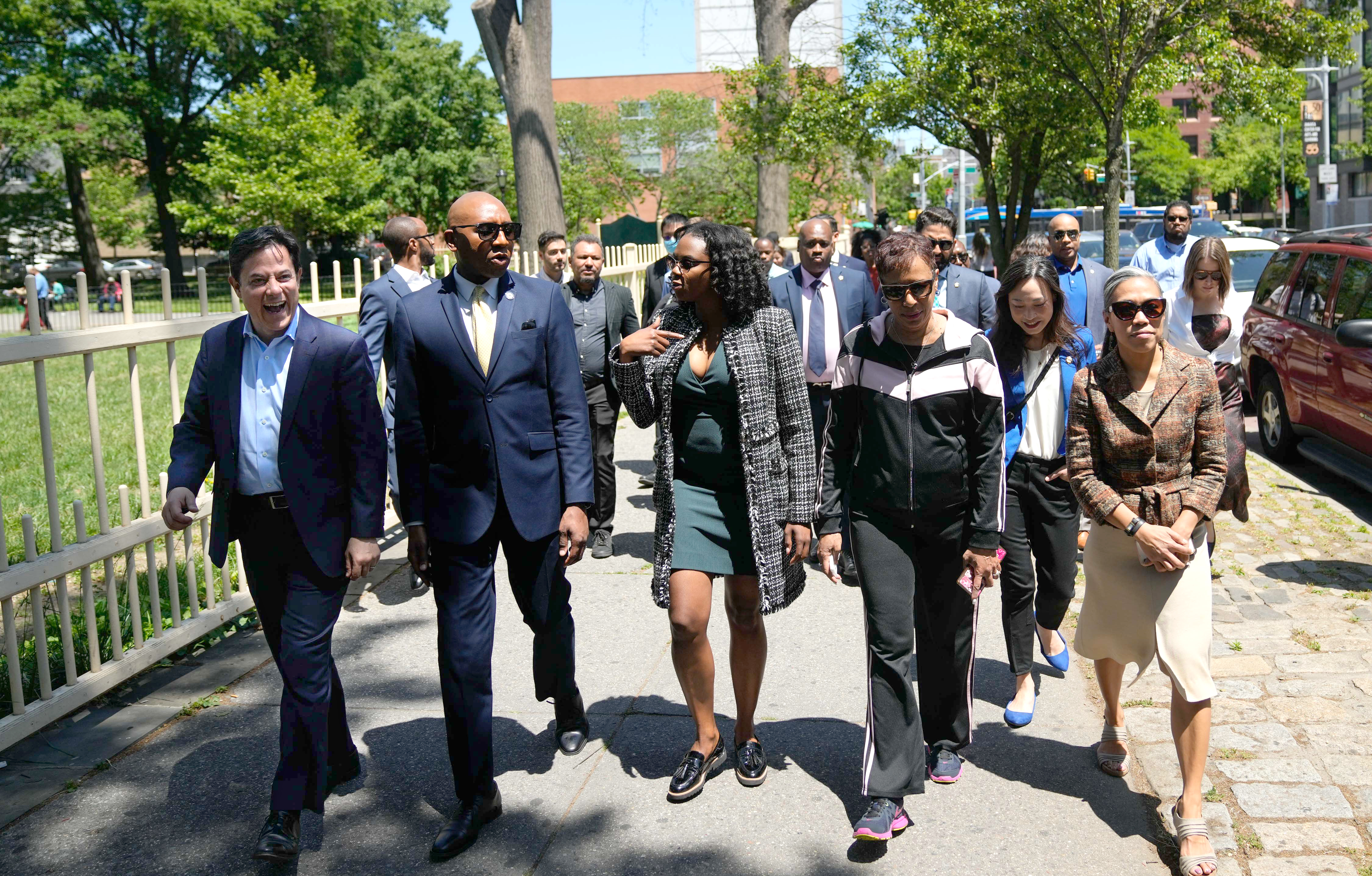 Dan Garodnick walking through NYC with large group on tour 
                                           