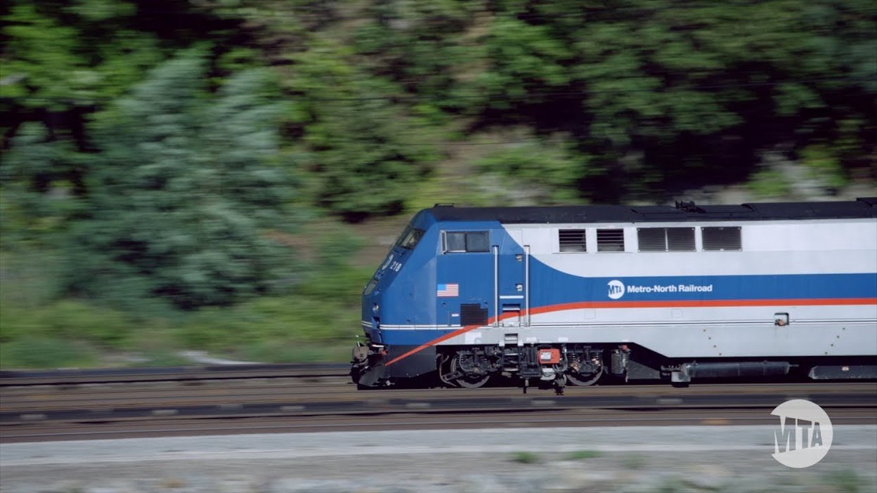 A Metro-North locomotive shown in motion.”
