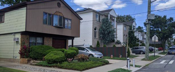 A view of small single-family homes during the day.