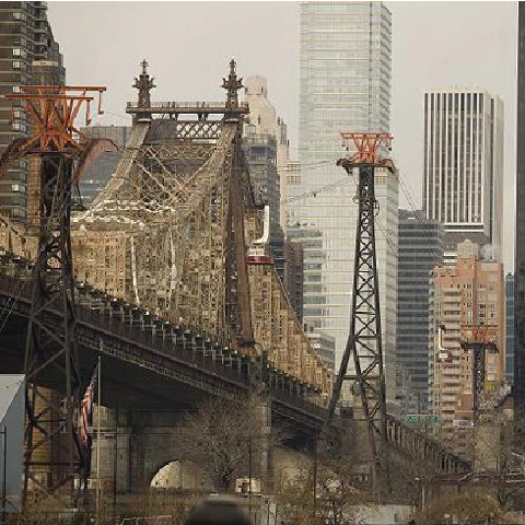 Bridge with tall buildings in the background