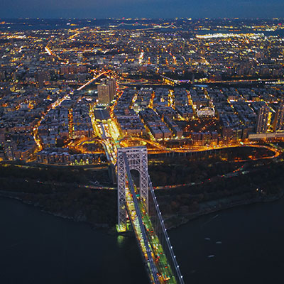 Aerial night view of a bridge and buildings
