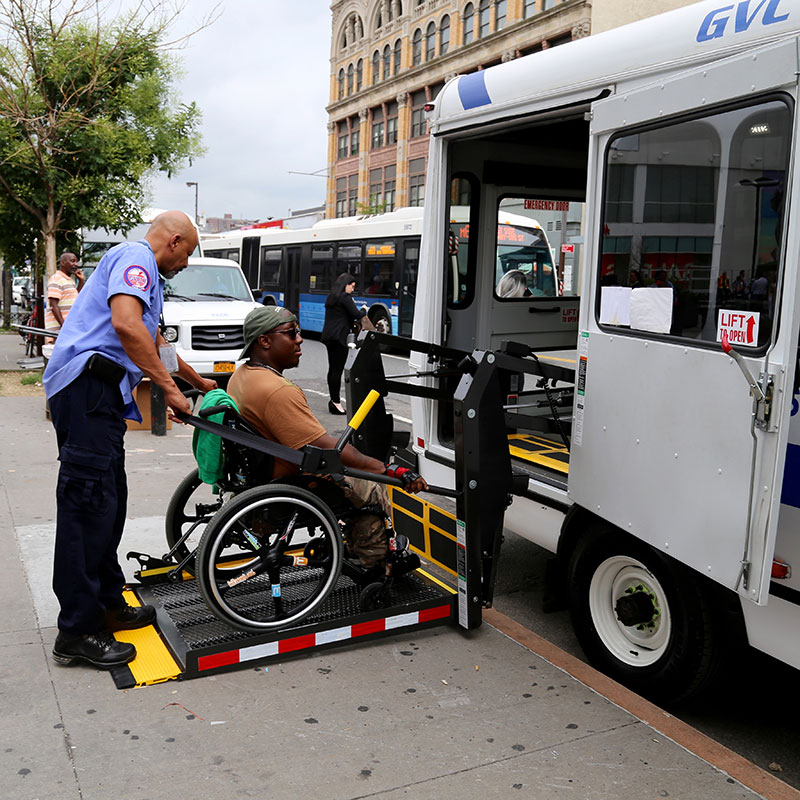 Person in a wheelchair entering a vehicle