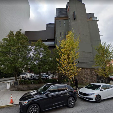 Vehicles in front of a hotel