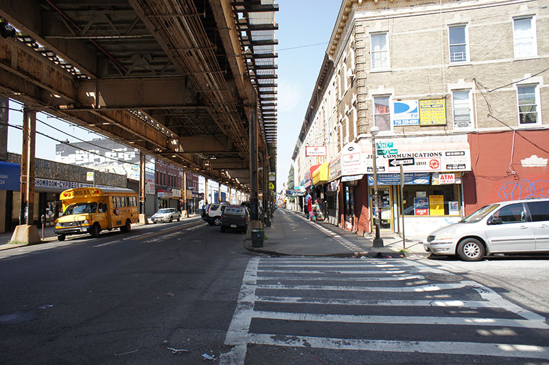 Fulton Street is a local retail corridor with the elevated J/Z train running above ground.
