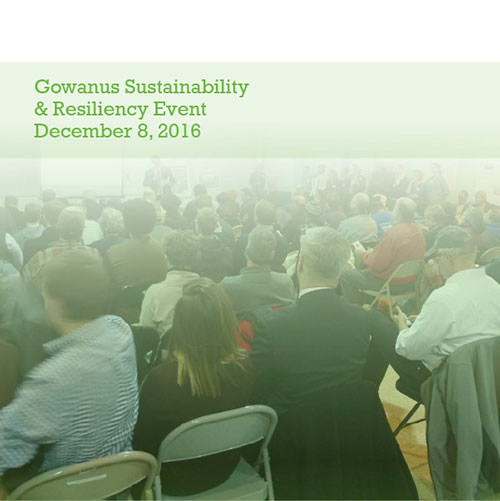 Cover page showing people seated in a large room