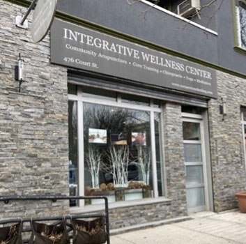 Storefront with sign that reads “Integrative Wellness Center”