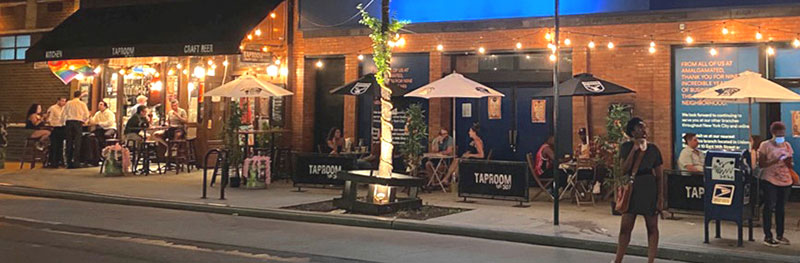 People in outdoor seating at a restaurant