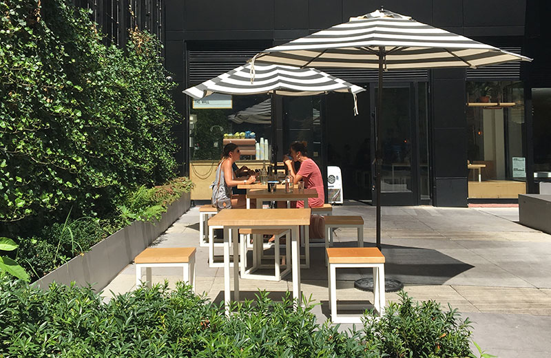 A small private café area within a plaza 