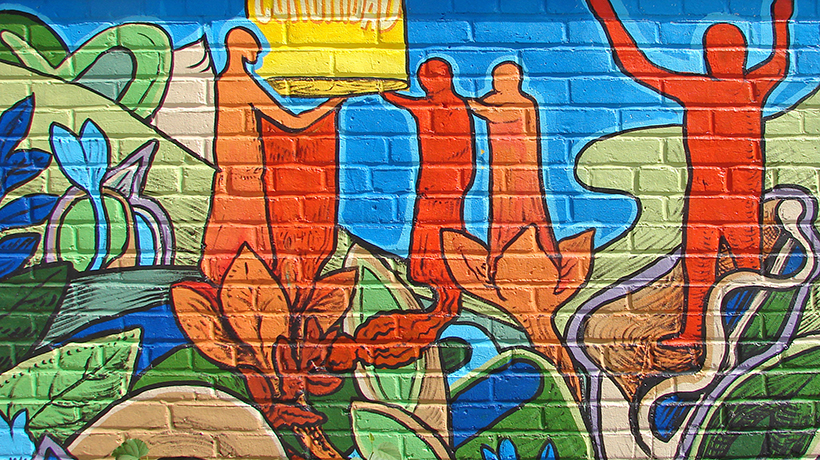 Community center mural on brick wall
                                           