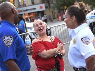 Photo of police officers chatting with local