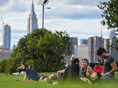 Photo of people sitting on grass