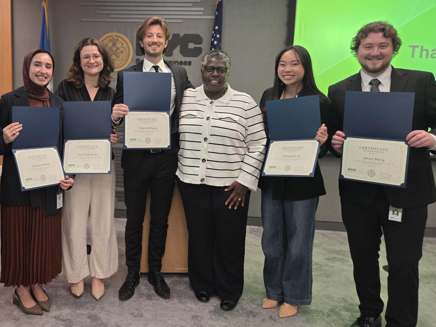 2025 Excelerator Fellows with S B S Commissioner Dynishal Gross at their graduation in the S B S conference room