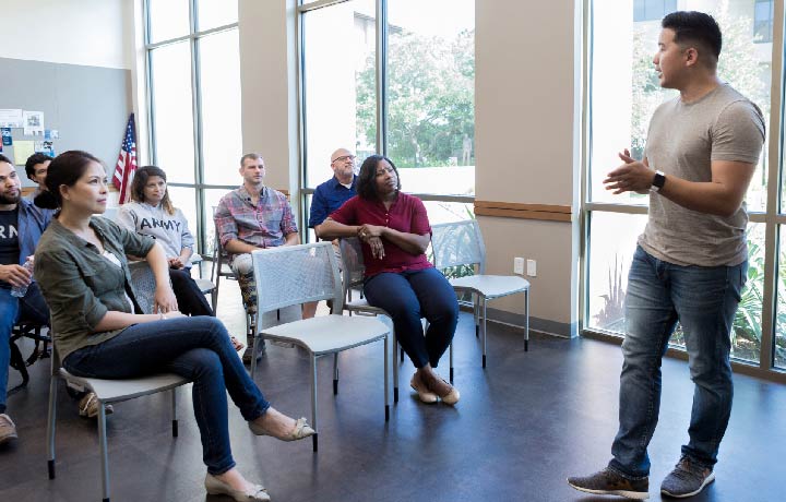 Man talking to a group of people
                                           