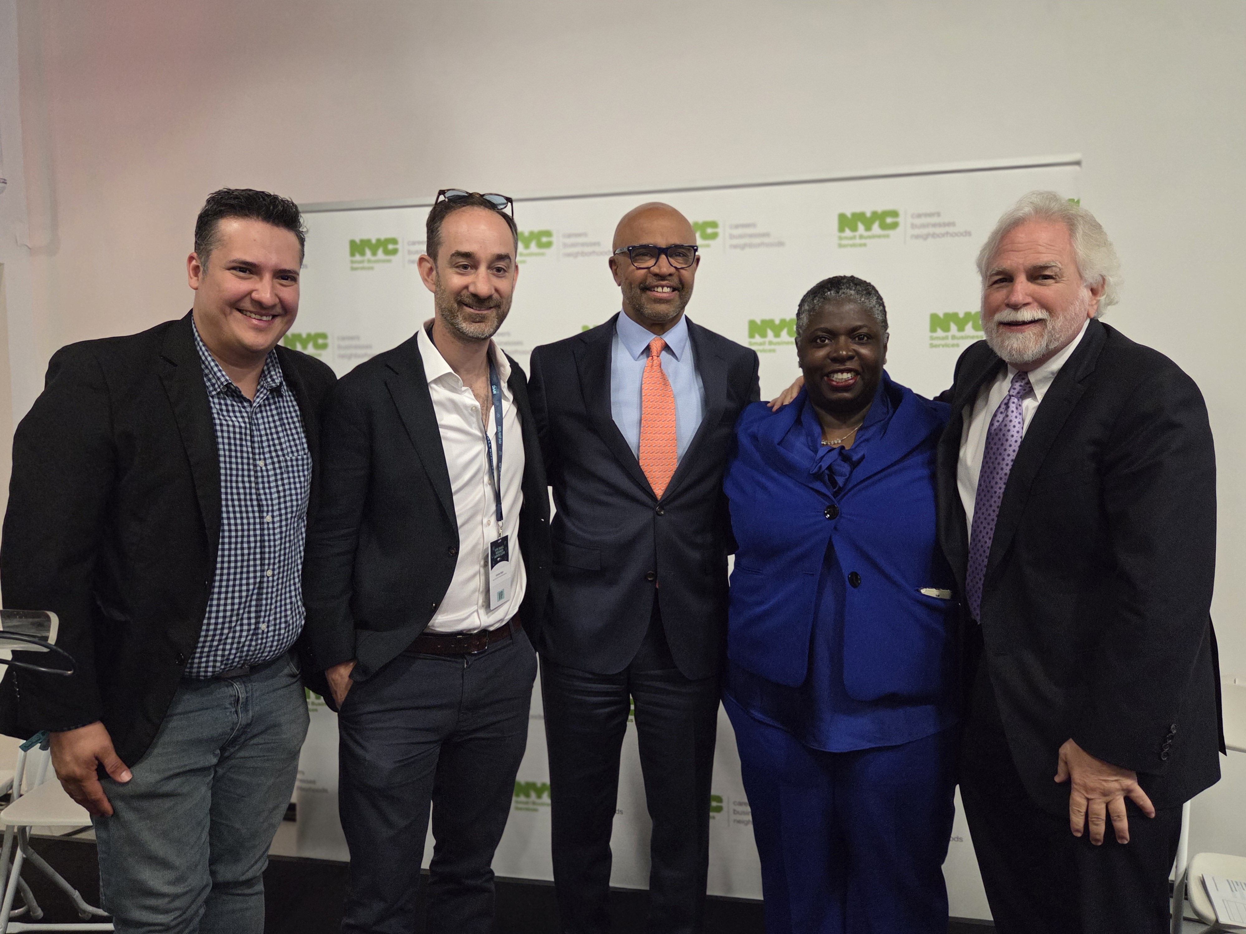 S B S Commissioner Dynishal Gross at the N Y C Small Business Month Expo with N Y C First Deputy Mayor Randy Mastro, Deputy Mayor for Housing, Economic Development, and Workforce Adolfo Carrión Jr., Andrew Rigie of the N Y C Hospitality Alliance, and a small business owner

                                           