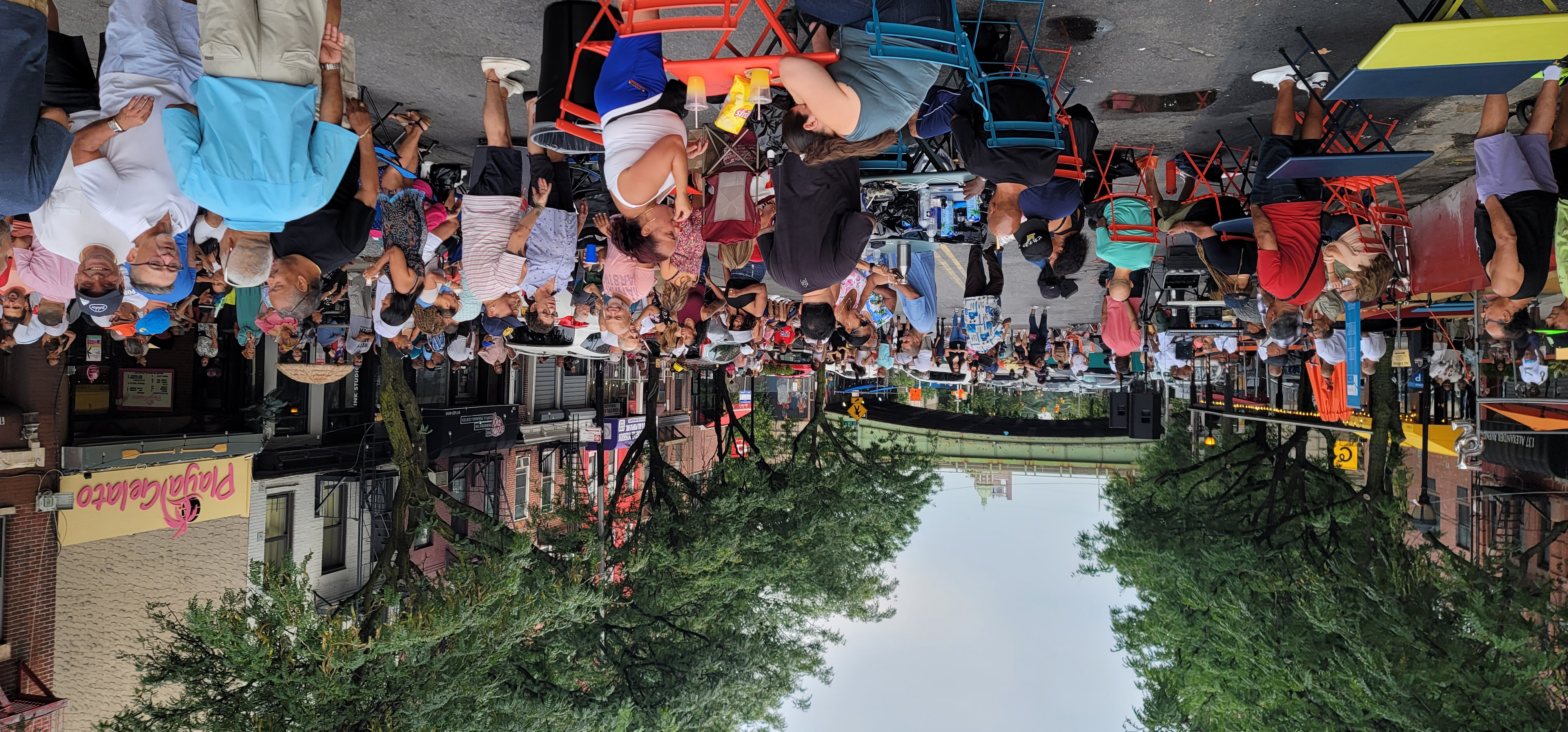 Large group of people at an event on a commercial corridor closed to vehicles
                                           