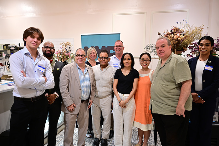 Group photo of Breaking Bread Building Bonds event organizers and guests.