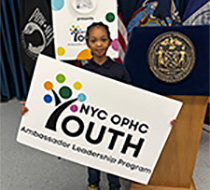 An elementary school girl hosts the YALP program sign