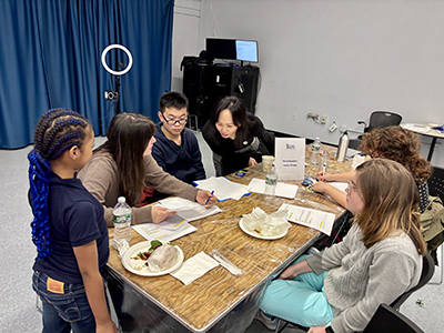 Mayor's Office of Criminal Justice mentors are working with a group of students