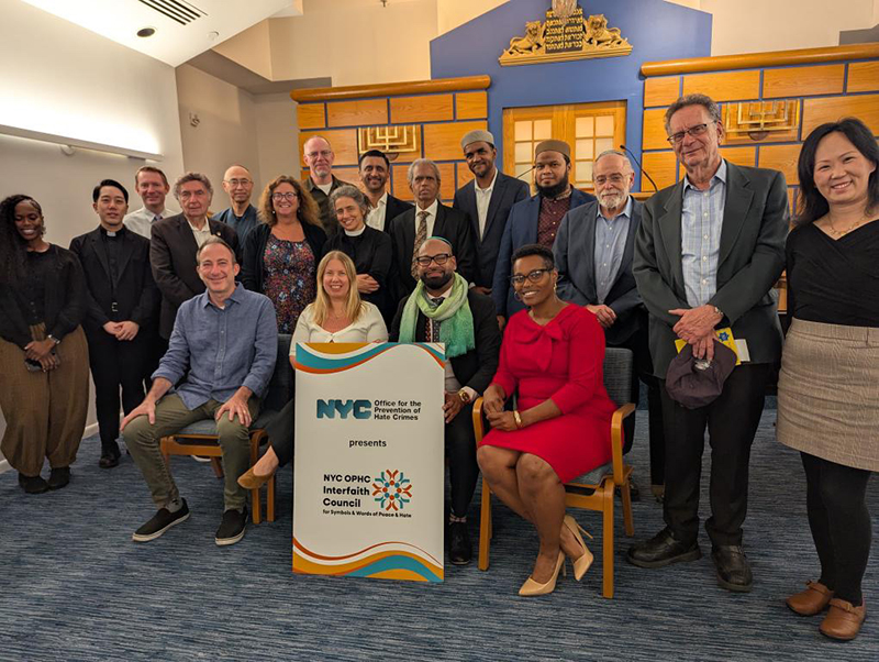 A group of faith leaders and OPHC staff are in group photo at Village Temple Synagogue