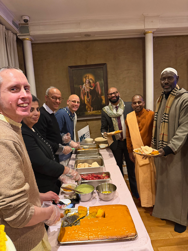 A group of faith leaders stood and smiled together