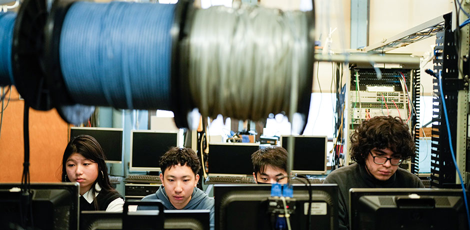Four young people training on the job
                                           