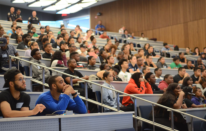 Young adults sitting in lecture hall
                                           