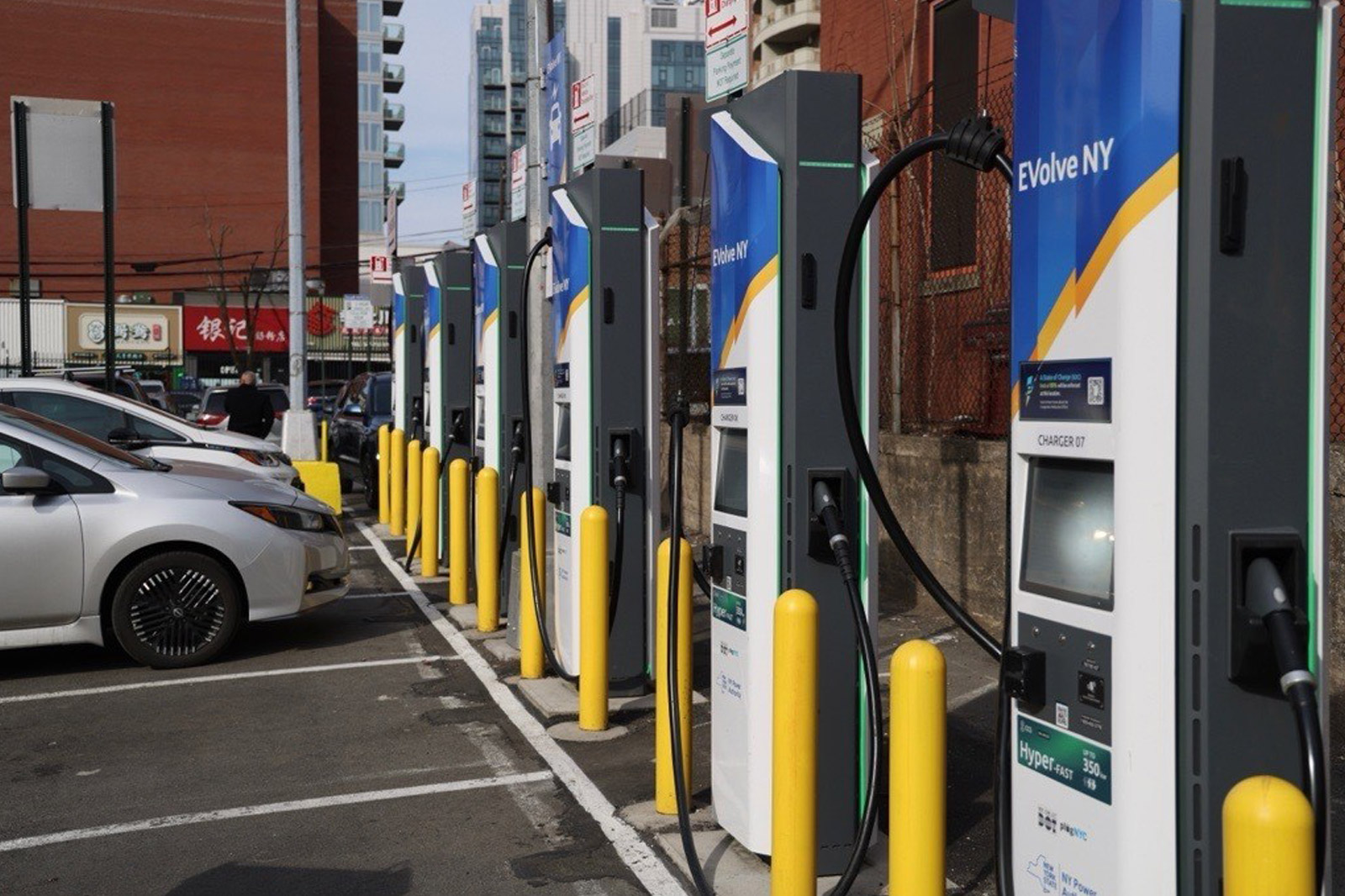 A electric car charging station, with charger units line up diagnally across from bottom right to top left