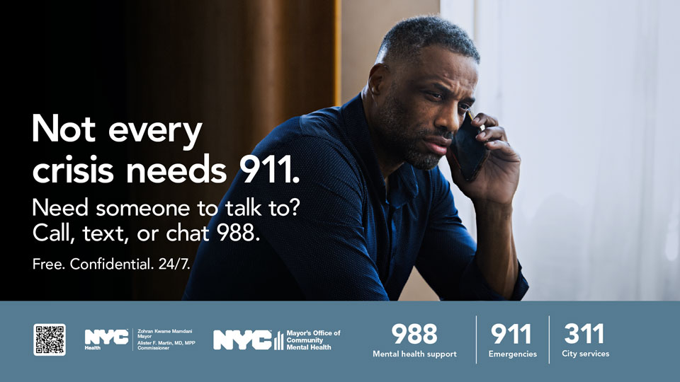 person holding a phone with N Y C ‘ s three emergency phone numbers 988, 911, and 311