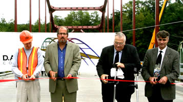 Left to right, John Healy, Vice President of D. A. Collins Construction Co., Inc.; Commissioner Christopher. O. Ward; Jim Brown, Supervisor of the Town of Gilboa; and Alan Rosa, Executive Director of the Catskill Watershed Corporation at ribbon-cutting ceremony.