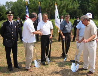 Ground-breaking ceremony for the new DEP Police precinct building at Beerston in the Town of Walton. Working the shovels left to right: DEP Commissioner Christopher O. Ward, Senator John Bonacic, Catskill Watershed Corporation Executive Director Alan Rosa, and Walton Village Mayor Carl Vogel.