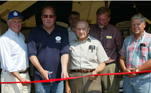 Ribbon cutting on Monday, August 12, at the Delaware County Fair event shared by Watershed Agricultural Council (WAC), Catskill Watershed Corporation (CWC) and the DEP. Left ot right, Richard Coombs, WAC Chair, DEP Commissioner Christopher O. Ward, Alan Rosa CWC Executive DIrector, Perry Shelton CWC President, NYS Agricultur & Markets Commissioner Nathan Rudgers, WAC Vice-chair Fred Huneke. At the ceremoony, Commissioner Ward announced the opening of almost 24,000 city-owned acres for the 2002 deer hunting season.