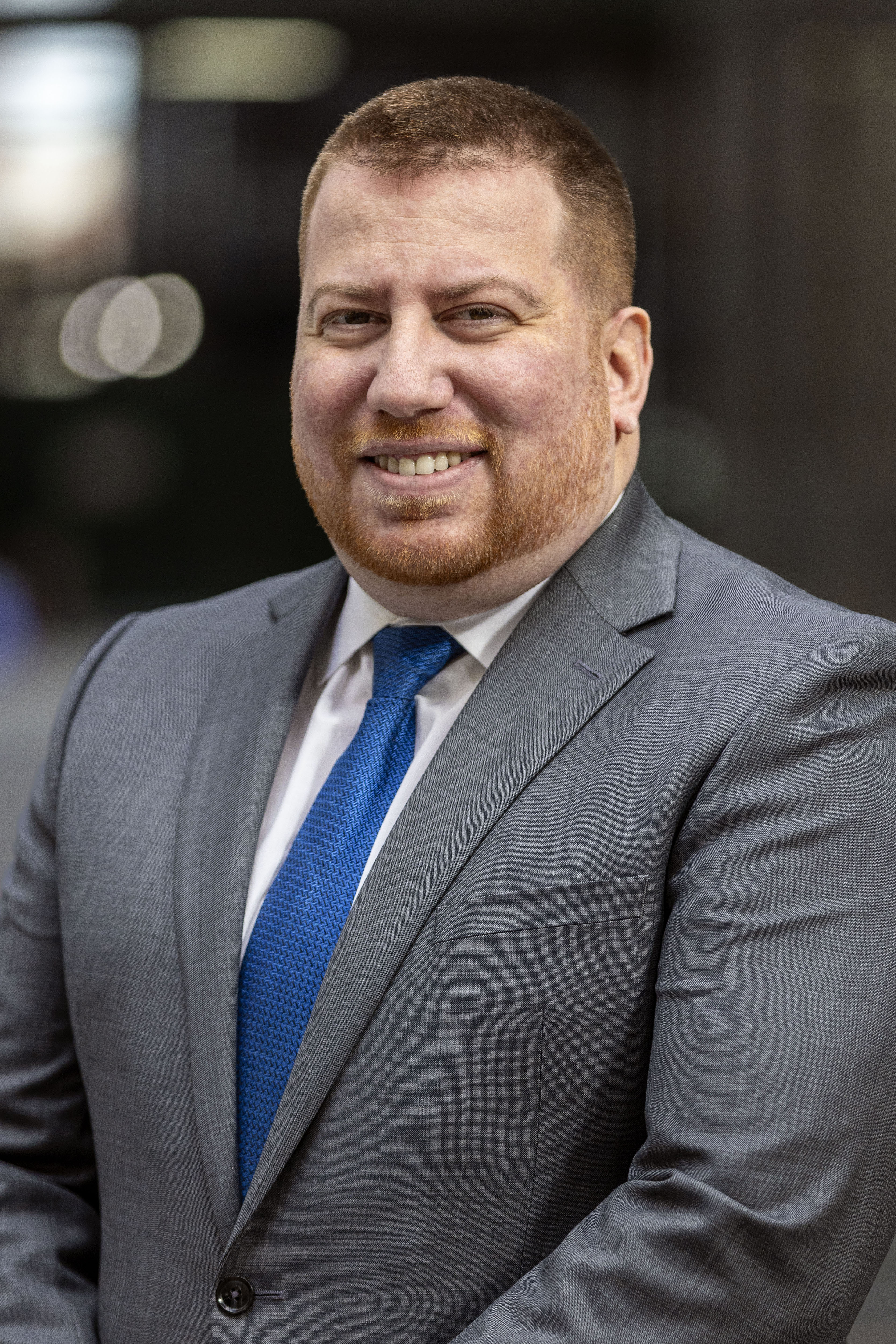 Portrait of Igor Yaroslavsky. He is wearing a grey suit, white shirt, and blue tie.