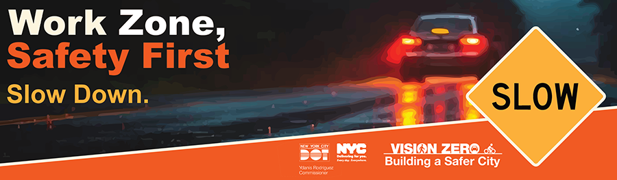 Car driving on a wet road at night with a yellow diamond-shaped 'SLOW' sign and logos for N Y C D O T, N Y C, and Vision Zero.