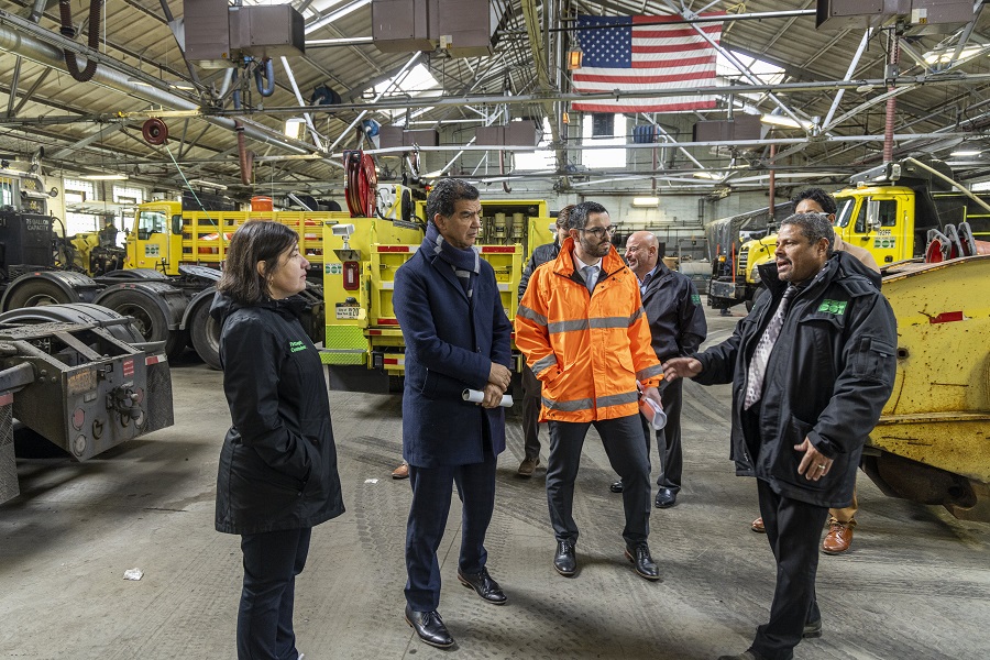 Commissioner Rodriguez meets with NYC DOT staff inside a fleet repair shop in Queens