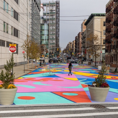 A colorful asphalt art mural covers Audubon Plaza in Washington Heights. 