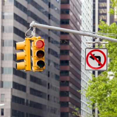 Closeup image of a traffic signal displaying the red light.