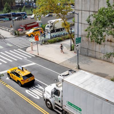 Trucks and other vehicles stopped at an intersection. 